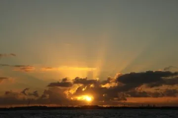 a sunset over a body of water