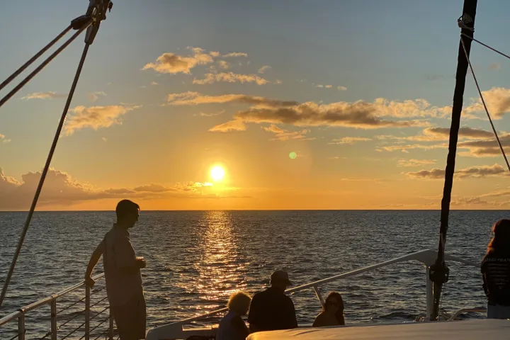 a group of people in a boat on a body of water